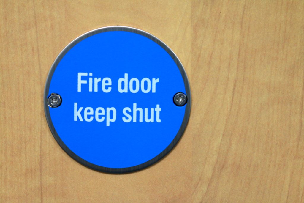 How to stop fire door slamming shut
